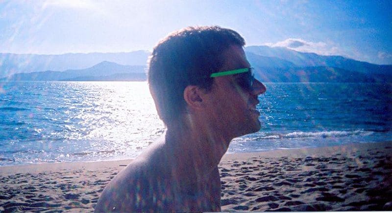 Man in sun on beach