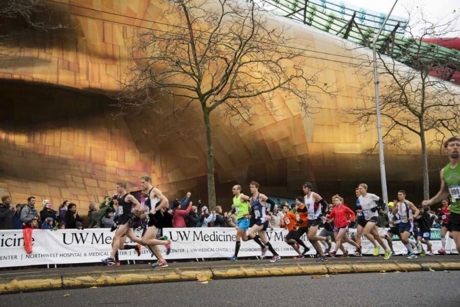 Seattle Marathon runners in front of MoPop