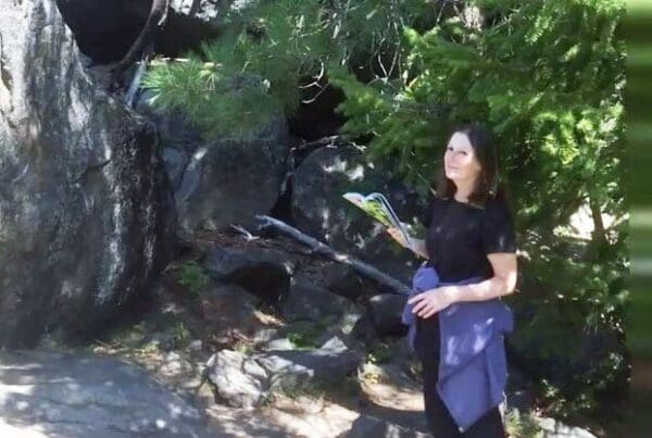 Julie Hartley reads a trail map while hiking near Leavenworth, Washington.