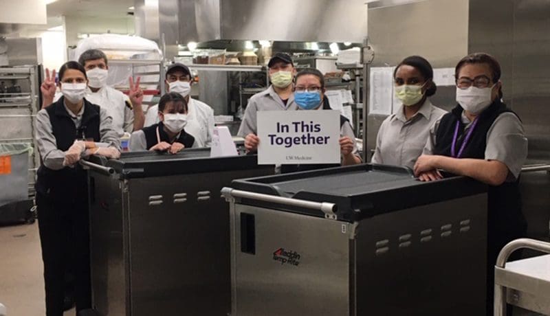 Food and Nutrition Services team in masks in the kitchen