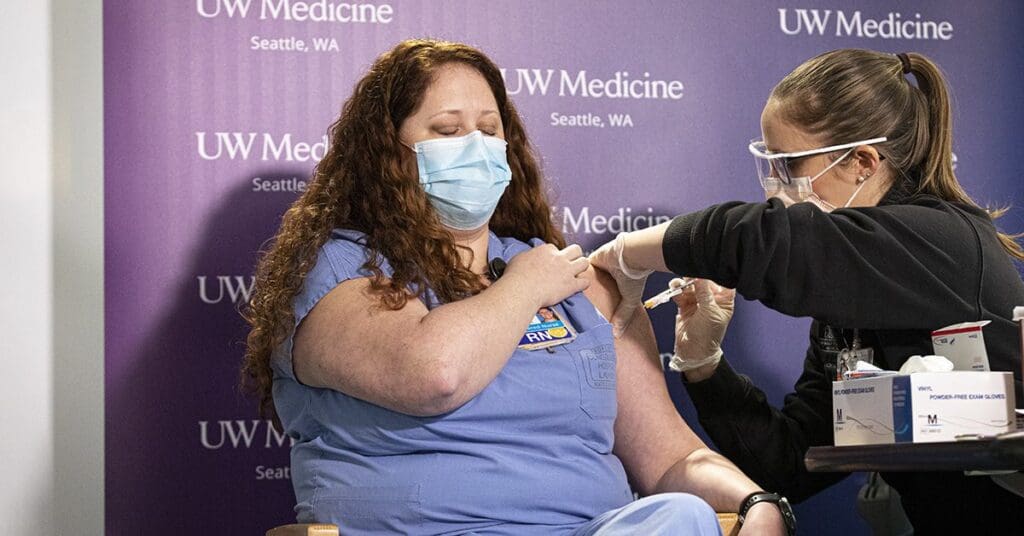Amy Fry receiving COVID-19 vaccine