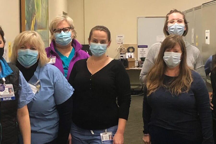UW Medical Center – Northwest staff and volunteers help administer late-night vaccines