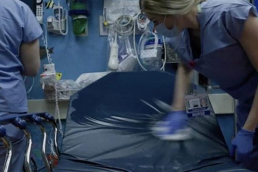 Nurse cleaning patient room.