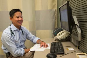 Eugene Yang working at desk