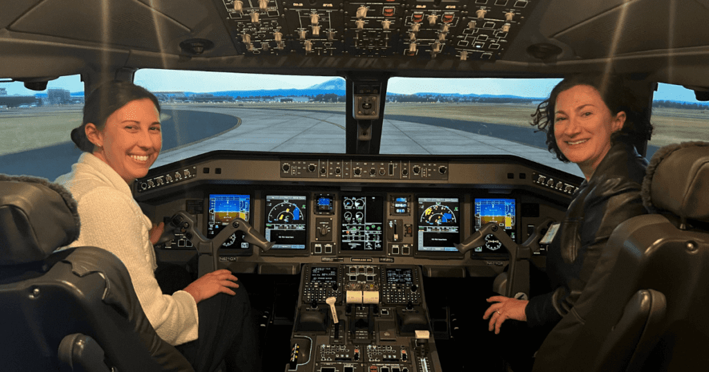 Hailey Silverii and Cindy Hamra in a flight simulator.